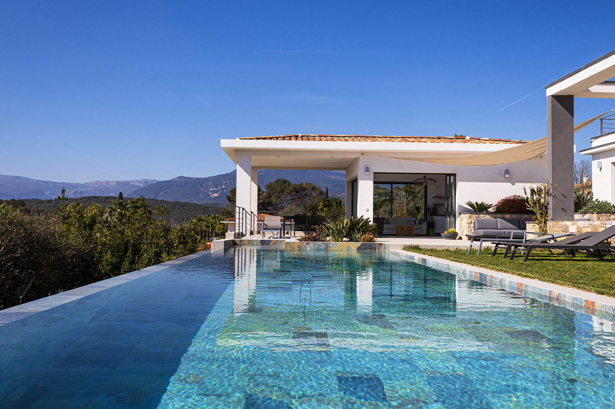 High-end property with infinity pool and natural stone finishes