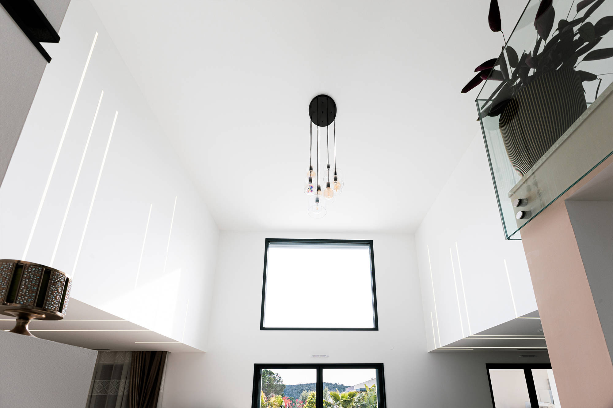 High ceiling interior with integrated linear lighting design