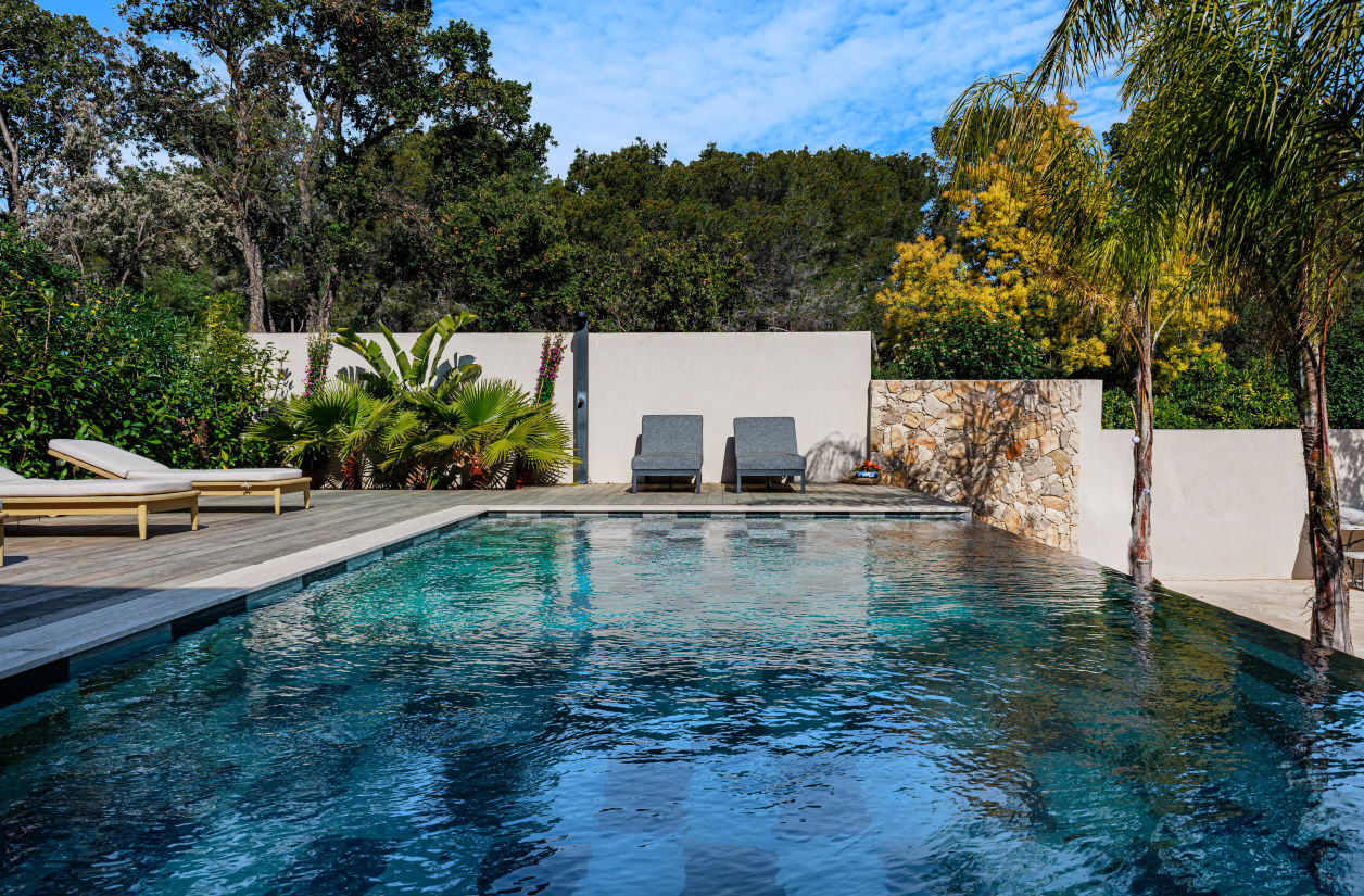 Bespoke infinity pool and modern pool house designed for a luxury villa project.