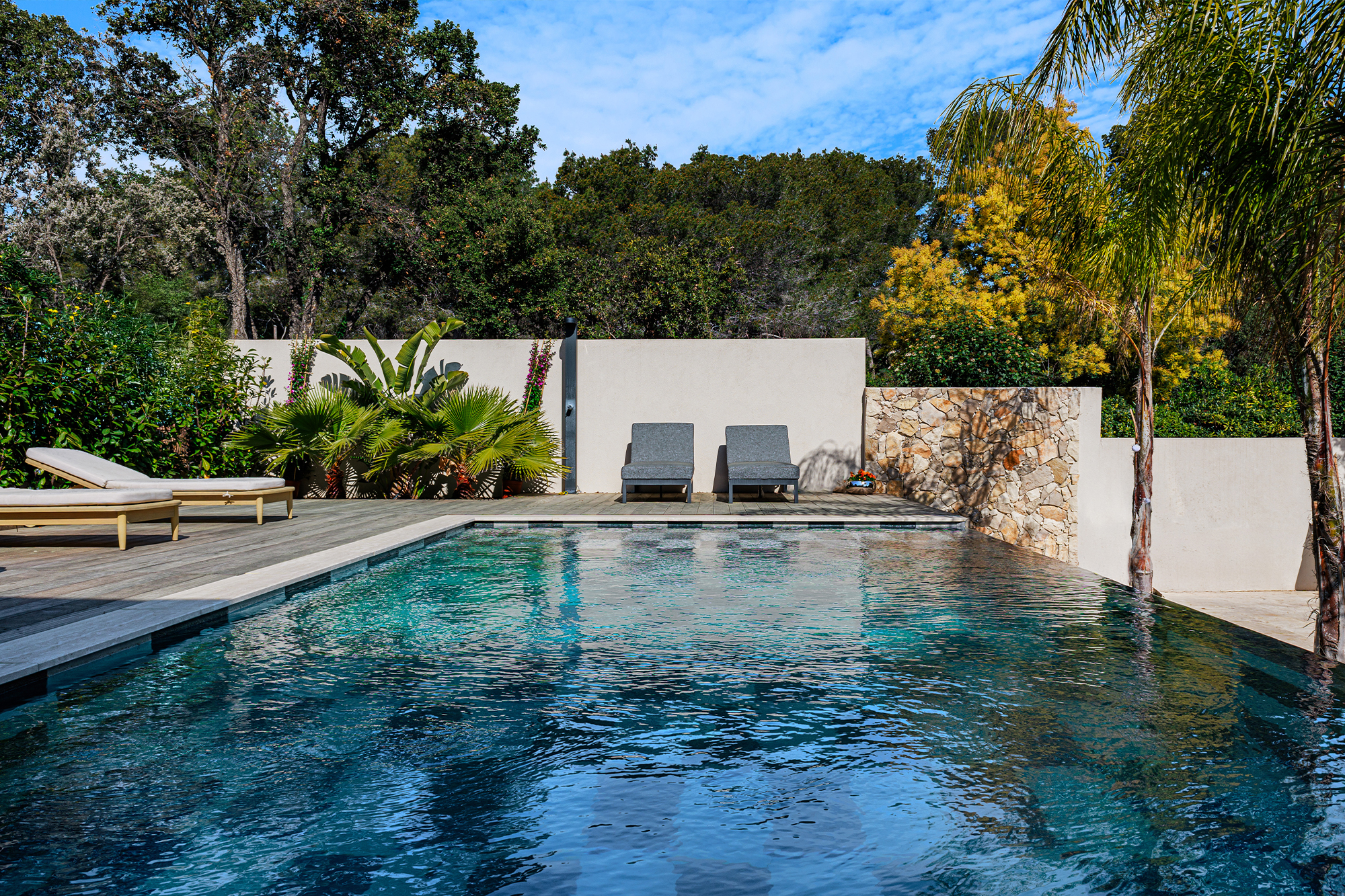 Renovated villa with outdoor living space and pool.