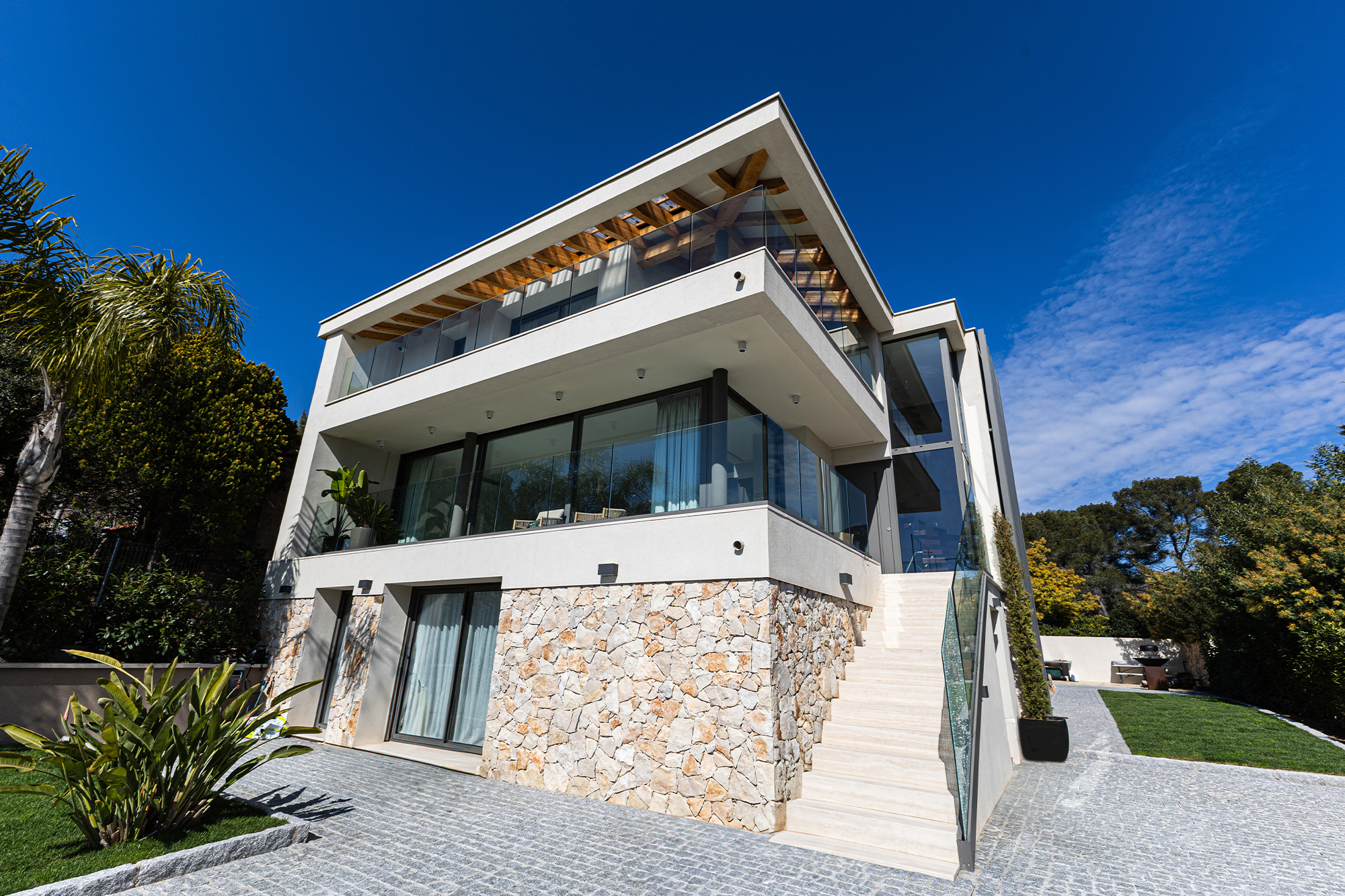 Luxury home renovation with swimming pool and garden.